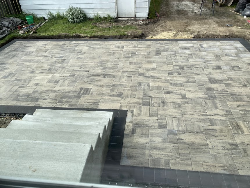 Interlocking paver patio installation