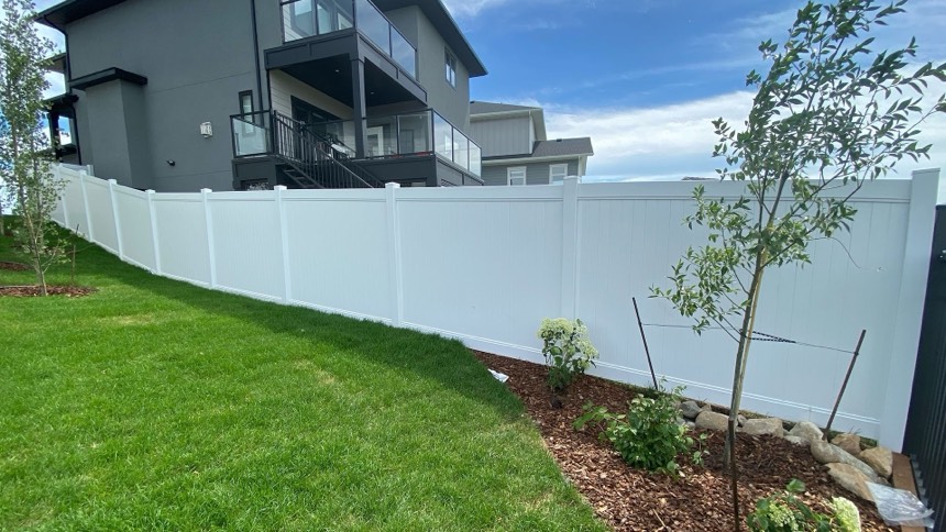 White vinyl privacy fence installation